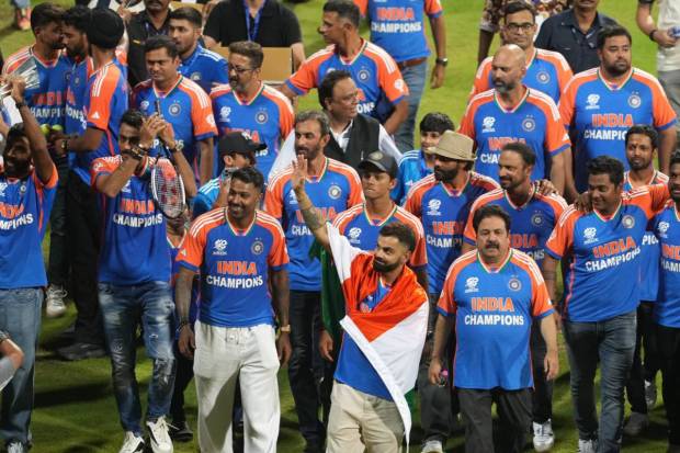 Players of the T20 World Cup-winning Indian cricket team take a victory lap during their felicitation ceremony at the Wankhede Stadium. (PTI)