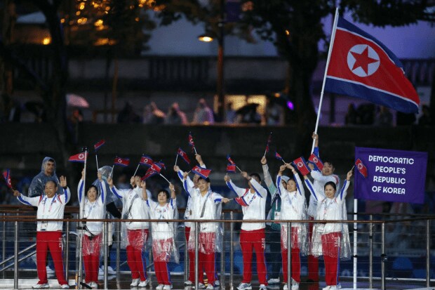 North Korean athletes wave at the Parade of Nations. North Korea was forbidden from competing in the 2022 Winter Olympics in Beijing as punishment for its 