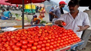 A vendor arranges tomatoes on a cart at a roadside vegetable market in Ahmedabad, India, July 7, 2023. REUTERS/Amit Dave/File Photo