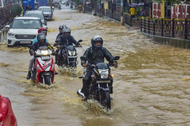 Guwahati: Vehicles move on a waterlogged road amid monsoon rain. (PTI)