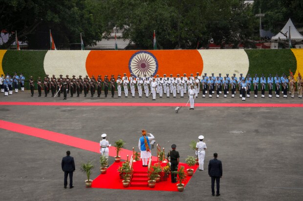 Tri-services personnel giving Guard of Honour to PM Modi. (Photo: PTI)