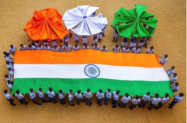 Students displaying the National flag during rehearsals for Independence Day in Chennai on August 13, 2024. (Photo source: PTI)