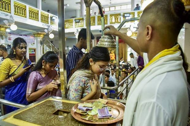 A monk blessing devotees during the celebration of Janmashtami festival at ISKCON Temple, in Guwahati. (Photo source: PTI)