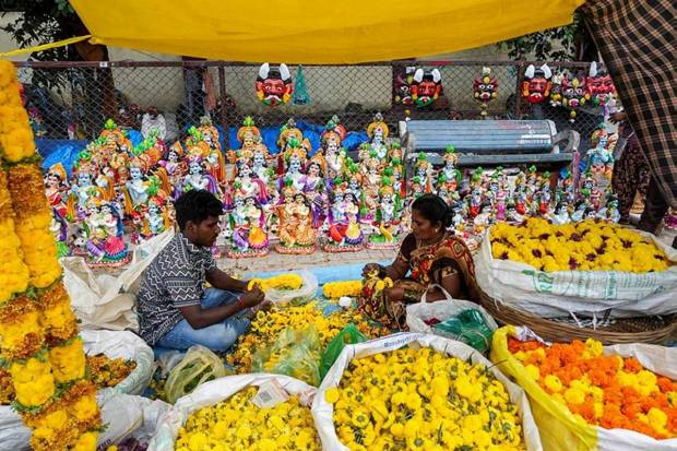 1. Vendors selling flowers and idols of Lord Krishna on eve of Janmashtami festival in Bengaluru. (Photo source: PTI)