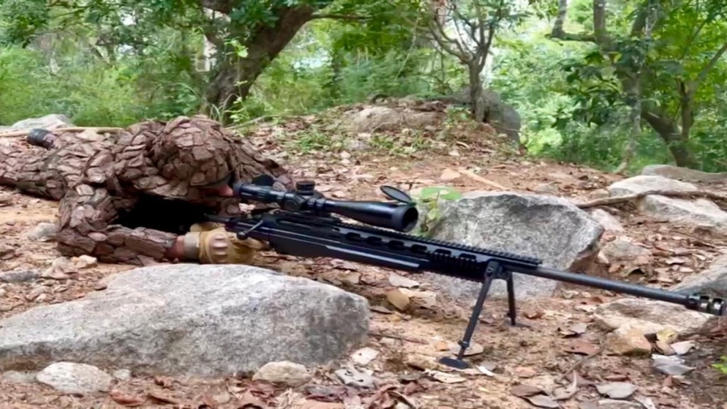 A sniper is a highly trained marksman who specializes in shooting targets from long distances, often concealed to avoid detection. (Image Source: ADGPI)