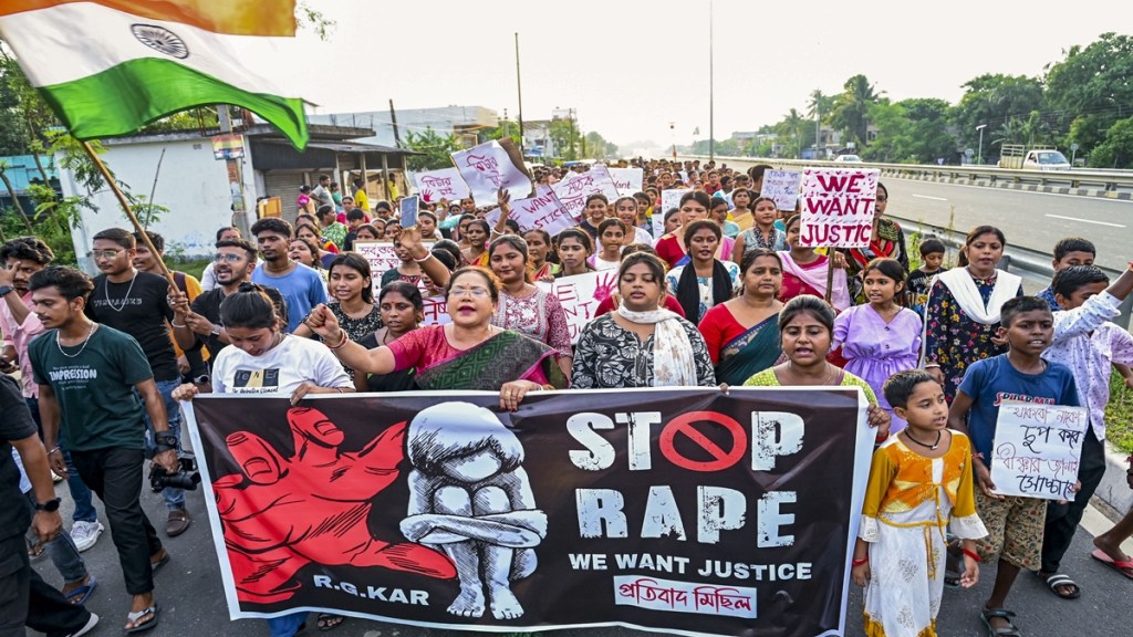 People raise slogans during a protest march against the recent alleged rape and murder of a woman trainee doctor of Kolkata’s RG Kar Medical College and Hospital, at Santipur, in Nadia district, Wednesday, Aug. 21, 2024. (PTI Photo) People raise slogans during a protest march against the recent alleged rape and murder of a woman trainee doctor of Kolkata’s RG Kar Medical College and Hospital, at Santipur, in Nadia district, Wednesday, Aug. 21, 2024. (PTI Photo)