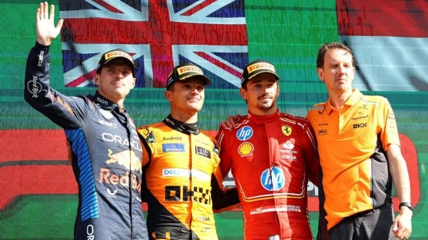 McLaren's Lando Norris celebrates on the podium after winning the Dutch Grand Prix alongside second placed Red Bull's Max Verstappen and third placed Ferrari's Charles Leclerc.