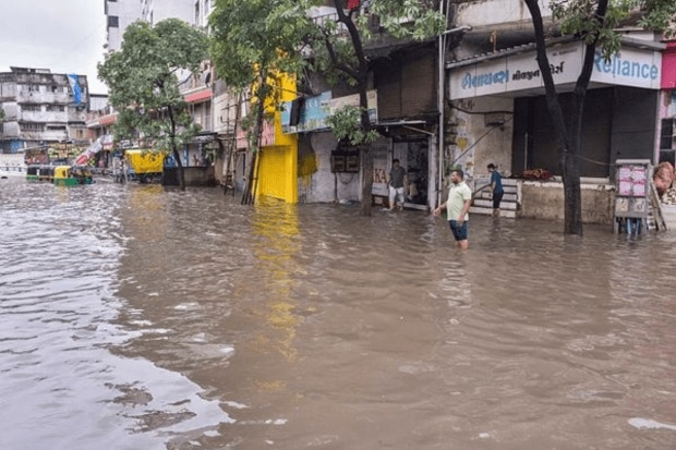 A flooded road in Ved Darwaja, Surat, after heavy rains. (PTI Photo)
