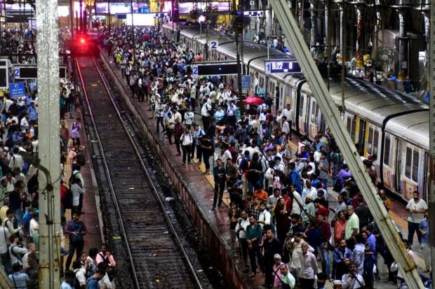 Local trains stopped between Kurla and Thane stations on the Central Line, stranding thousands of commuters. (PTI)