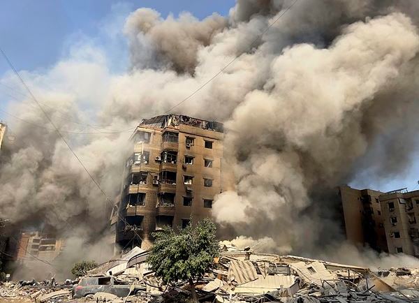 Smoke rises as a building collapses in Beirut's southern suburbs, Saturday, Sept. 28, 2024. (AP/PTI)
