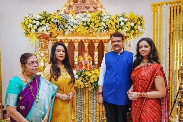 Maharashtra Deputy Chief Minister Devendra Fadnavis with his family members after 'pranpratishtha' of Lord Ganesh at his official residence on Ganesh Chaturthi festival, in Mumbai. (Photo: PTI)