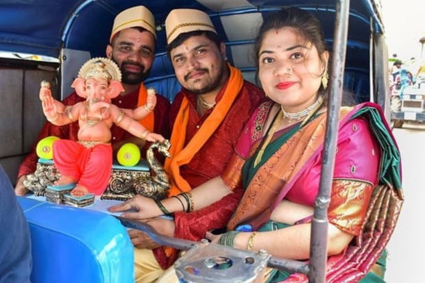  Devotees carry an idol of Lord Ganesh on ‘Ganesh Chaturthi’ festival, in Hubballi. (Photo: PTI)