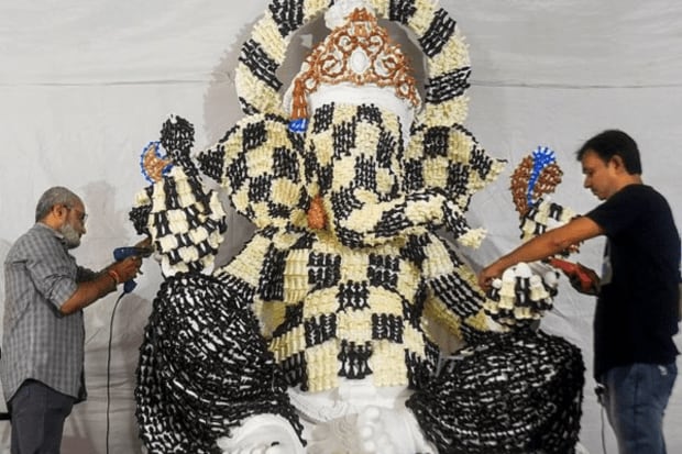 Artists prepare an idol of Lord Ganesha covered with chess pieces ahead of the ‘Ganesh Chaturthi’ festival, in Mumbai. (Photo: PTI)