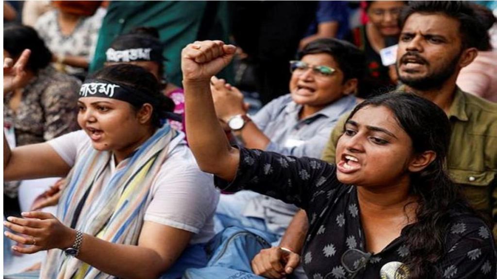 Medics sit and chant slogans as they attend a protest condemning the rape and murder of a trainee medic at a government-run hospital, in Kolkata, India, September 10, 2024. (Image: PTI)