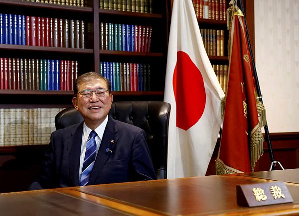 Shigeru Ishiba, the newly elected leader of Japan's ruling party, the Liberal Democratic Party (LDP) poses in the party leader's office after the LDP leadership election, in Tokyo, Japan September 27, 2024. (REUTERS)