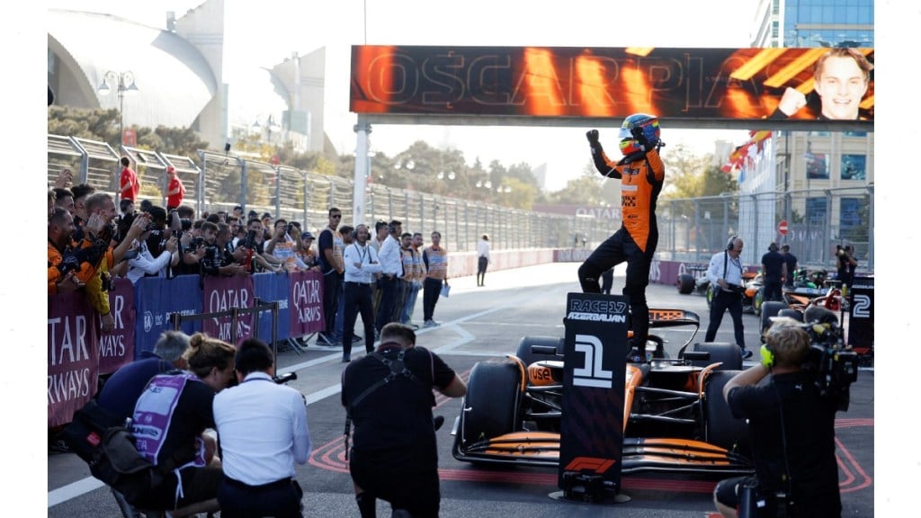 McLaren's Oscar Piastri celebrates after winning the race REUTERS