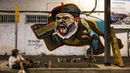 Israeli graffiti artist Maayan, from the Grafitiyul group, rests after she finished working on a graffiti of Hezbollah leader Sayyed Hassan Nasrallah after Israel's military confirmed it had eliminated him in a Beirut airstrike, in Tel Aviv, Israel, September 29, 2024. (REUTERS)