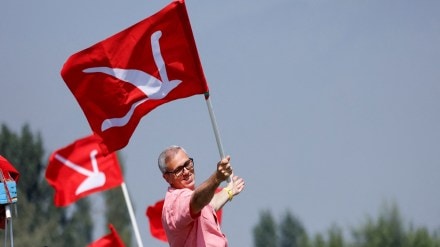 Omar Abdullah, Vice President of the Jammu and Kashmir National Conference (JKNC) and former Chief Minister of Jammu and Kashmir, poses with his party's flag in the waters of Dal Lake during an election campaign in the lake, in Srinagar September 22, 2024. REUTERS.
