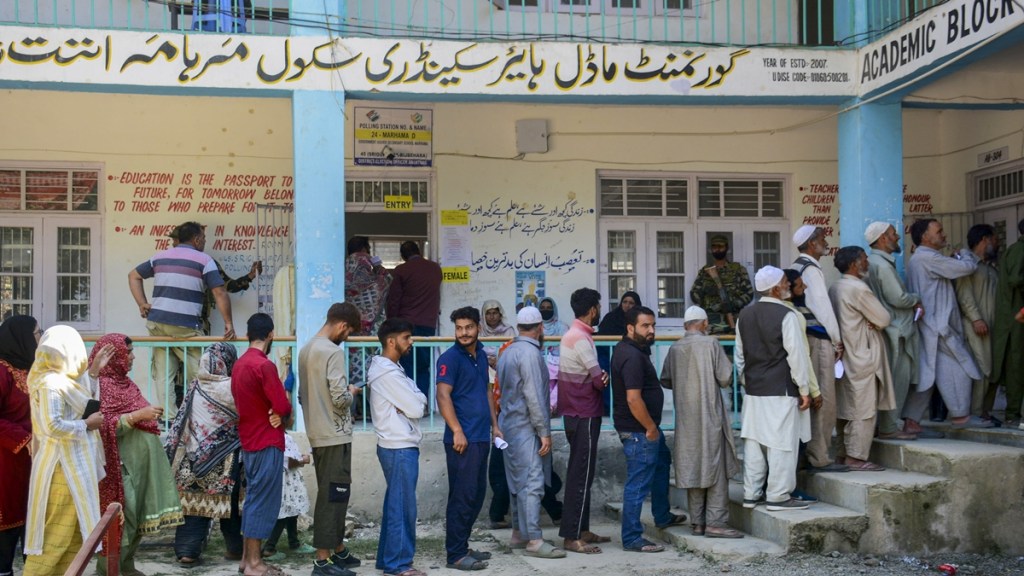 Voters stand in a queue to cast votes at a polling station during the first phase of Jammu and Kashmir Assembly elections, in Anantnag district of J&K, Wednesday, Sept. 18, 2024. (PTI Photo)