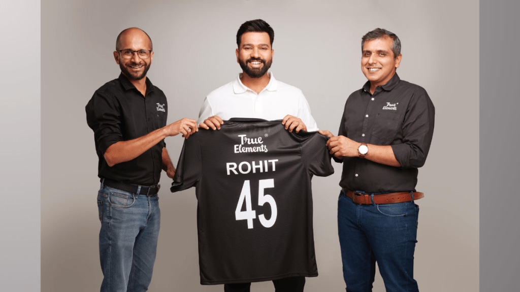 "Rohit Sharma partners with True Elements to promote health-conscious snacking, launching a new line of premium products aimed at redefining healthy eating in India." "Rohit Sharma partners with True Elements to promote health-conscious snacking, launching a new line of premium products aimed at redefining healthy eating in India."