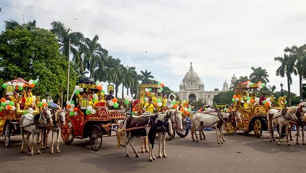 Students ride chariots on World Tourism Day, near Victoria Memorial, in Kolkata, Friday, Sept 27, 2024.