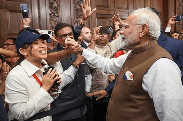 PM Modi meeting Indian community in America upon his arrival at a hotel in Wilmington. (PTI Photo)
