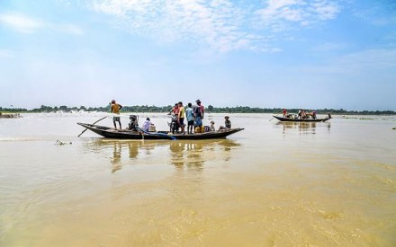 Nadia: People use boats to cross a flooded area at Santipur, in Nadia district, Sunday, Sept. 22, 2024. (PTI Photo)