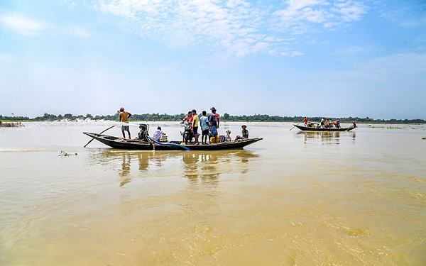 Nadia: People use boats to cross a flooded area at Santipur, in Nadia district, Sunday, Sept. 22, 2024. (PTI Photo)
