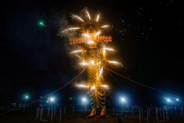An effigy of demon king Ravan burns during celebration of Vijayadashami organised by Shree Geeta Colony Dharmik Ramleela Committee, in East Delhi.