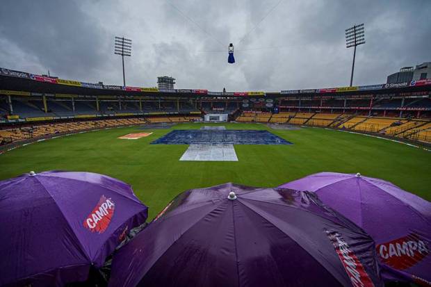 The pitch covered during rains on the first day of the first test cricket match between India and New Zealand at M Chinnaswamy Stadium, in Bengaluru, on Wednesday, October 16, 2024. (Photo source: PTI) 
