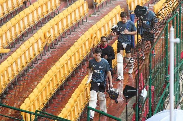 New Zealand's players Mark Chapman and Mitchell Santner leave after a training session ahead of the first Test cricket match between India and New Zealand, at M Chinnaswamy Stadium in Bengaluru. (Photo source: PTI)