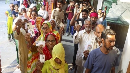 Voters wait in a queue to cast their votes at a polling station during the Haryana Assembly elections, in Rohtak district, Saturday, Oct. 5, 2024. (PTI Photo)