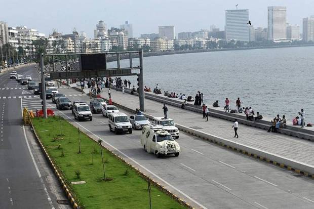 A van carrying the body of former chairman of Tata Group Ratan Tata, moves along the Marine Drive for his funeral in Mumbai. (Photo source: Reuters)