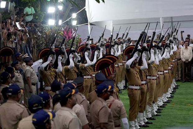 Police officers fire their rifles as a mark of respect on the day of the funeral of the former chairman of Tata Group Ratan Tata at a crematorium ground in Mumbai. (Photo source: Reuters)