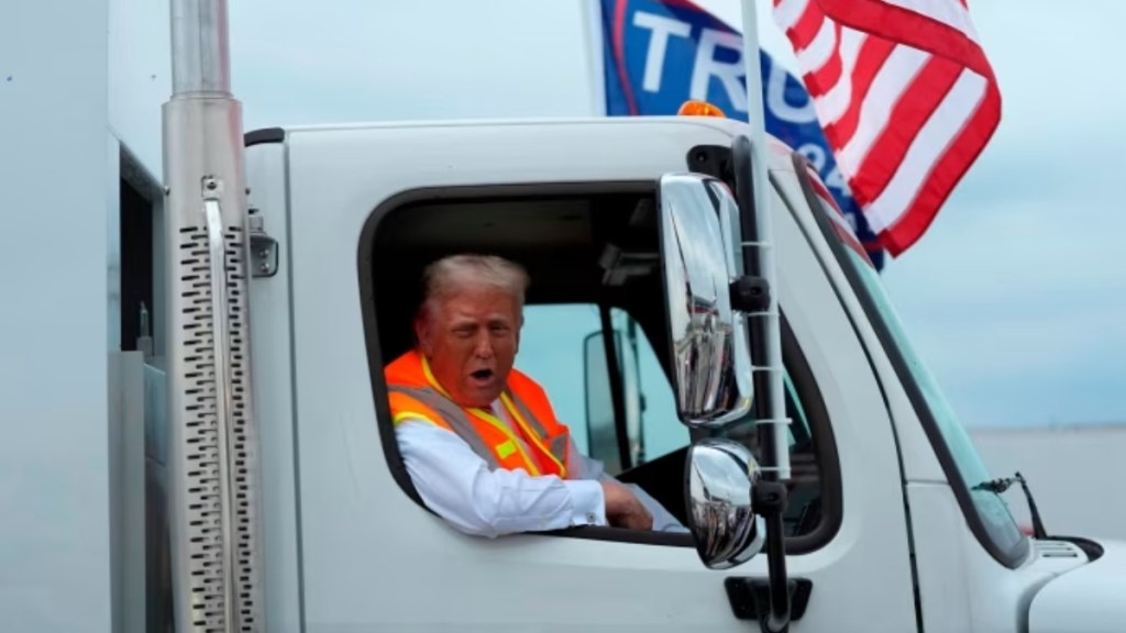 Trump rallies support by climbing into a garbage truck, calls out Biden and Harris