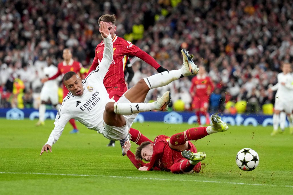 Liverpool's Conor Bradley tackles Real Madrid's Kylian Mbappe (left) during the Champions League at Anfield Stadium, Liverpool, England (ap/pti) Liverpool's Conor Bradley tackles Real Madrid's Kylian Mbappe (left) during the Champions League at Anfield Stadium, Liverpool, England (ap/pti)