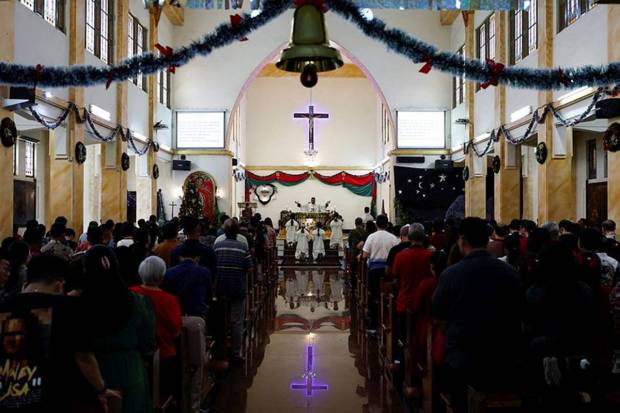 Catholics attend a mass during Christmas celebrations at the Sacred Heart Catholic Church, ahead of the 20th anniversary of Indian Ocean earthquake and tsunami, in Banda Aceh, Aceh, Indonesia. (Photo source: Reuters)