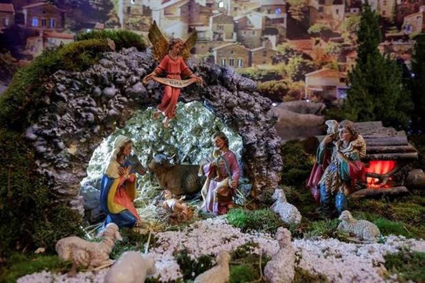 The statue of baby Jesus is placed at a nativity scene at St. Nicholas church in the Croatian minority town, in Janjevo, Kosovo (Photo source: Reuters)