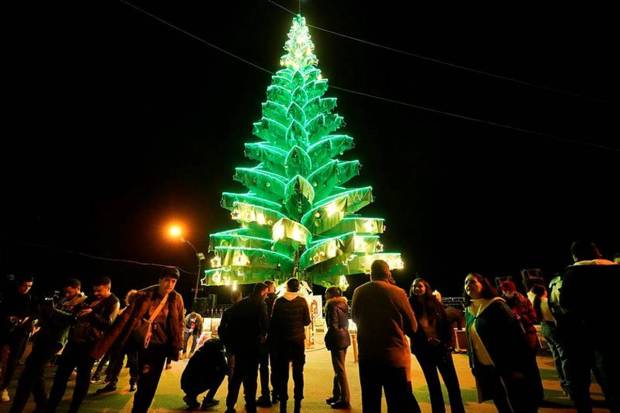 Syrian citizens gather outside Saydnaya Convent during the lighting of the Christmas tree, in Saydnaya town on the outskirts of Damascus, Syria. (Photo source: AP/PTI)