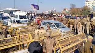 Police and security personnel stand guard at a barricaded road at the Delhi-Uttar Pradesh border amid traffic congestion ahead of Leader of Opposition in the Lok Sabha Rahul Gandhi’s visit to violence-hit Sambhal, in Ghaziabad, Wednesday, Dec. 4, 2024. (PTI Photo)