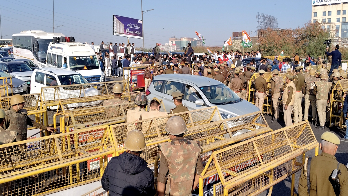 Police and security personnel stand guard at a barricaded road at the Delhi-Uttar Pradesh border amid traffic congestion ahead of Leader of Opposition in the Lok Sabha Rahul Gandhi’s visit to violence-hit Sambhal, in Ghaziabad, Wednesday, Dec. 4, 2024. (PTI Photo) Police and security personnel stand guard at a barricaded road at the Delhi-Uttar Pradesh border amid traffic congestion ahead of Leader of Opposition in the Lok Sabha Rahul Gandhi’s visit to violence-hit Sambhal, in Ghaziabad, Wednesday, Dec. 4, 2024. (PTI Photo)
