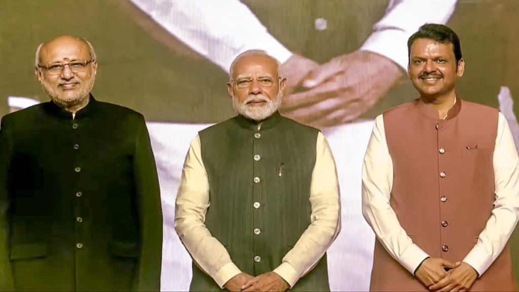 Prime Minister Narendra Modi and Maharashtra Governor CP Radhakrishnan with the newly-sworn Maharashtra Chief Minister Devendra Fadnavis during the swearing-in ceremony, in Mumbai, Thursday, Dec. 5, 2024. (PTI Photo)