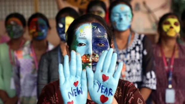 Chennai: A student, with her hands and face painted, poses for a photo ahead of New Year celebrations at a college in Chennai. (ANI Photo)