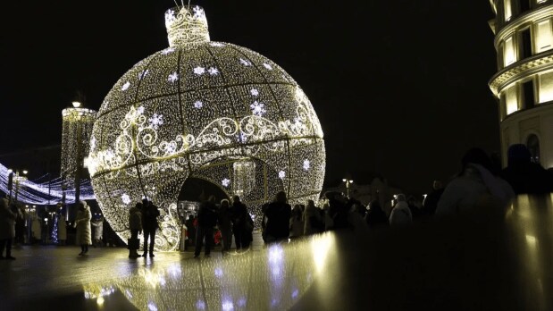 Moscow: People walk past New Year and Christmas decorations in Moscow, Russia. (REUTERS)