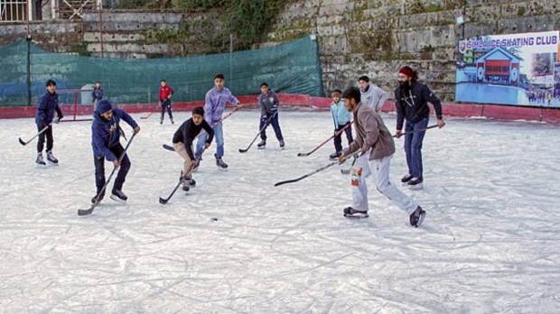 Ice hockey enthusiasts showcase their skills at Lakkar Bazar in Shimla on Saturday, December 21, 2024. The lively game amid the winter chill adds a vibrant touch to the season, attracting spectators to the iconic skating rink. (Photo: PTI)