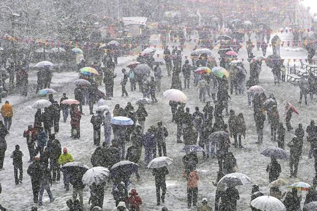 Visitors enjoying fresh snowfall, in Shimla. (Photo source: PTI)