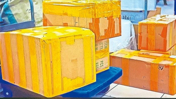Packages ready to be delivered in Opera of Trade and Commerce indicate a consumerist society