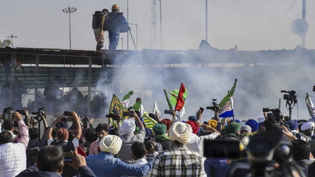Tear gas being used by security personnel to disperse the farmers moving towards barricades during their foot march to Delhi, at Shambhu border in Patiala district, Punjab, Friday, Dec. 6, 2024