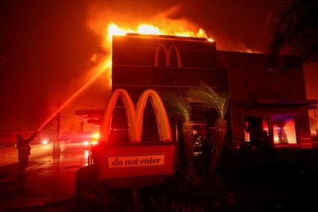 Firefighters battle flames as the Eaton Fire continues to burn in Pasadena, California, on January 7, 2025. (Image Source: Reuters)