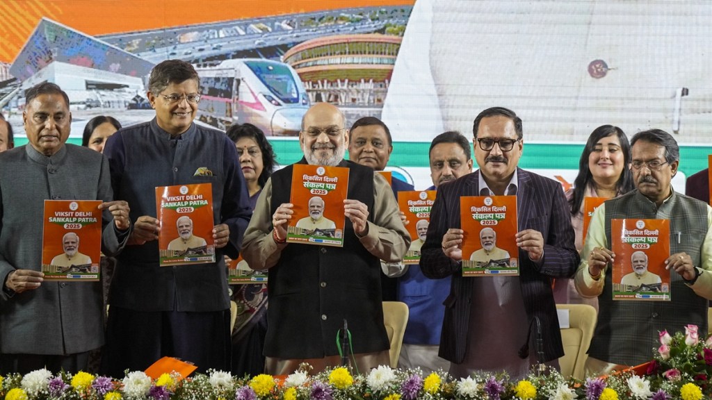 Union Home Minister Amit Shah along with BJP National Vice President Baijayant Panda, Delhi BJP President Virendra Sachdeva, Union MoS Harsh Malhotra, BJP MP Ramvir Singh Bidhuri and others releases third part of BJP's manifesto for the upcoming Delhi Assembly elections, in New Delhi, Saturday, Jan. 25, 2025. (PTI Photo)